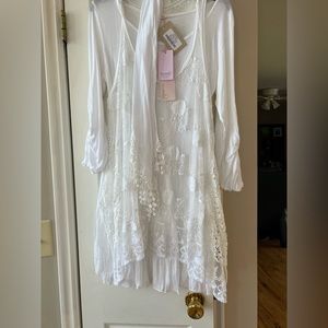 Scandal sleeveless lace vest and 3 quarter length whir shirt with add on scarf.